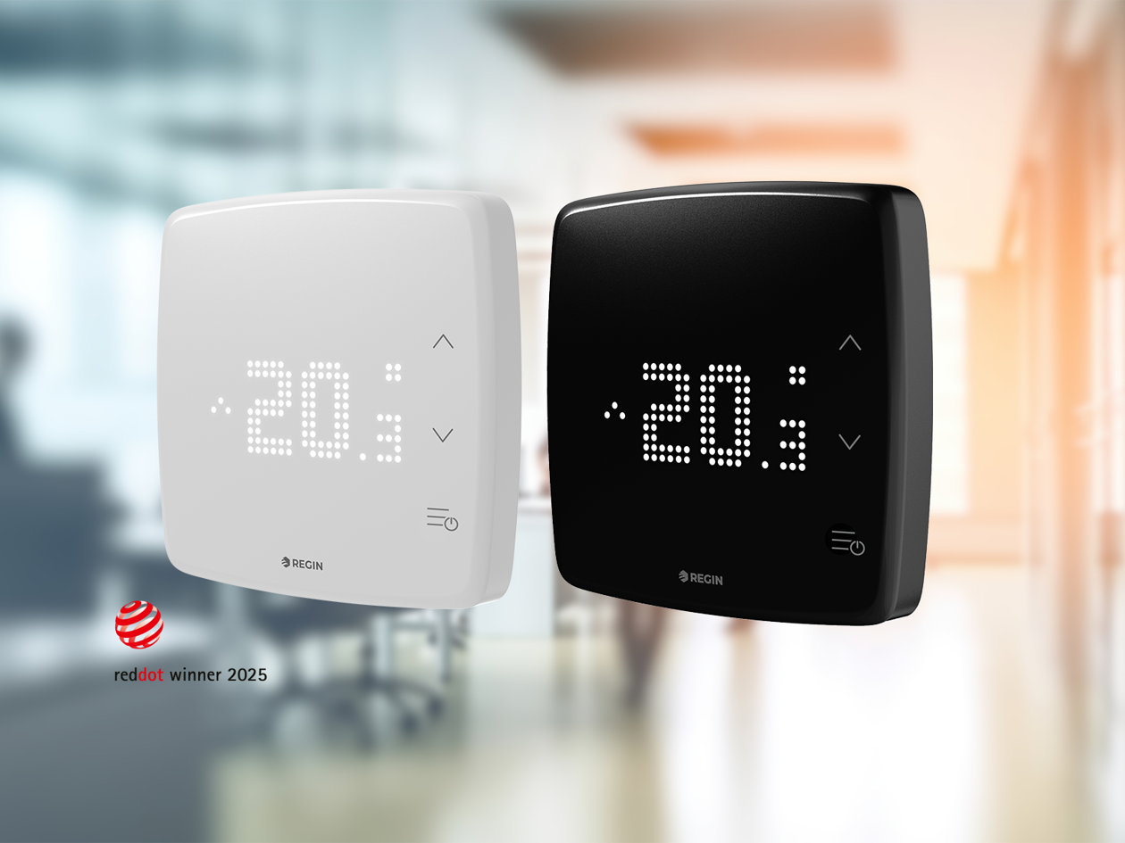 Two modern thermostats, one white and one black, display 20°C in a blurred office background.